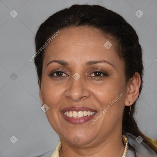 Joyful latino adult female with medium  brown hair and brown eyes