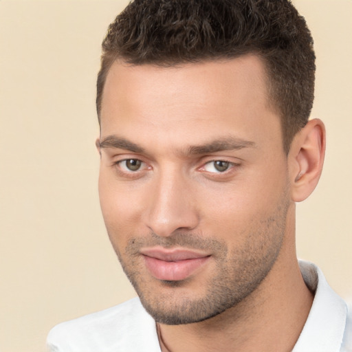 Joyful white young-adult male with short  brown hair and brown eyes