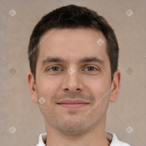 Joyful white young-adult male with short  brown hair and brown eyes