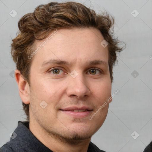 Joyful white adult male with short  brown hair and grey eyes