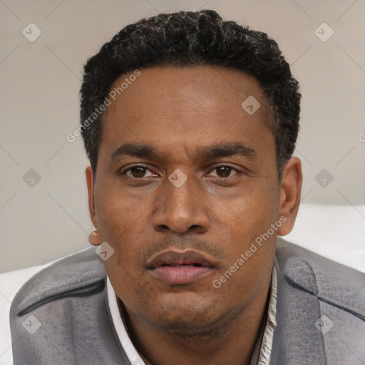 Neutral latino young-adult male with short  black hair and brown eyes