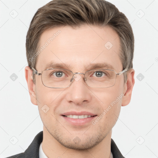 Joyful white adult male with short  brown hair and grey eyes