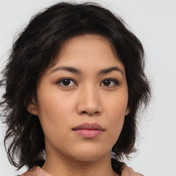 Neutral asian young-adult female with medium  brown hair and brown eyes