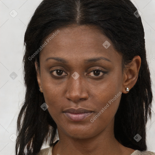 Joyful black young-adult female with long  brown hair and brown eyes