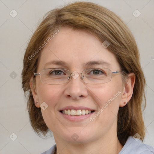 Joyful white adult female with medium  brown hair and blue eyes