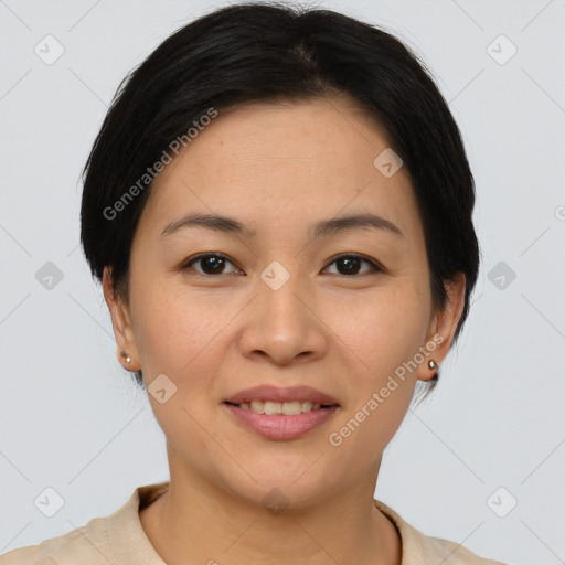 Joyful asian young-adult female with short  brown hair and brown eyes