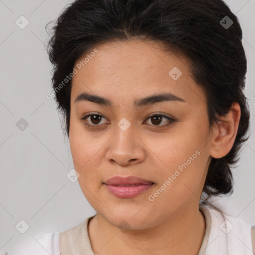 Joyful latino young-adult female with medium  brown hair and brown eyes