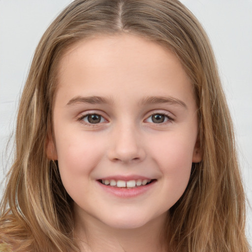 Joyful white child female with long  brown hair and brown eyes