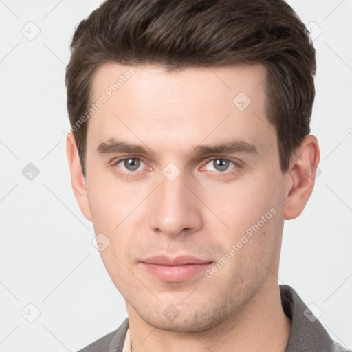 Neutral white young-adult male with short  brown hair and brown eyes