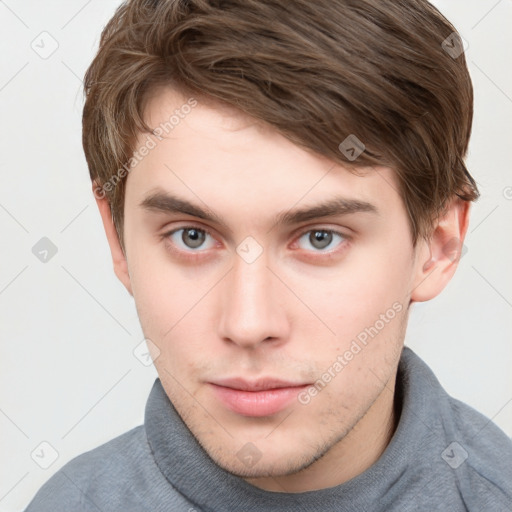 Neutral white young-adult male with short  brown hair and grey eyes