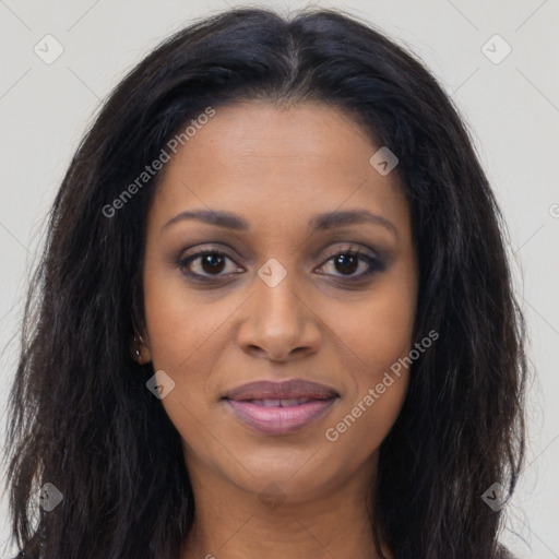 Joyful black young-adult female with long  brown hair and brown eyes