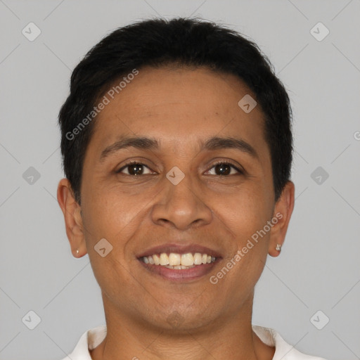 Joyful latino young-adult male with short  brown hair and brown eyes