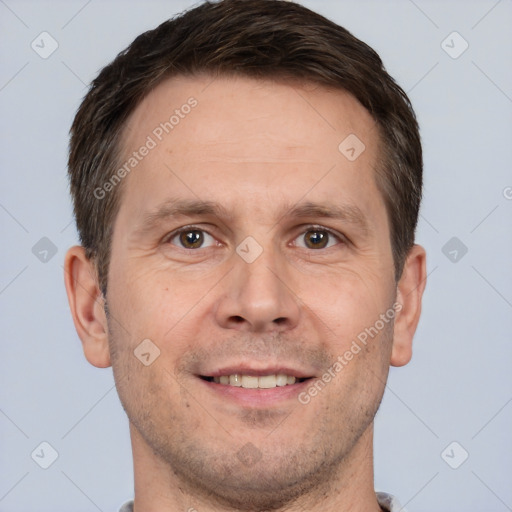 Joyful white adult male with short  brown hair and brown eyes