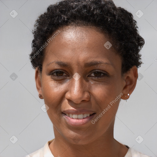 Joyful black adult female with short  brown hair and brown eyes