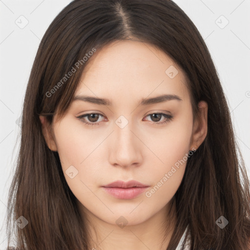 Neutral white young-adult female with long  brown hair and brown eyes