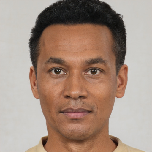 Neutral black adult male with short  black hair and brown eyes