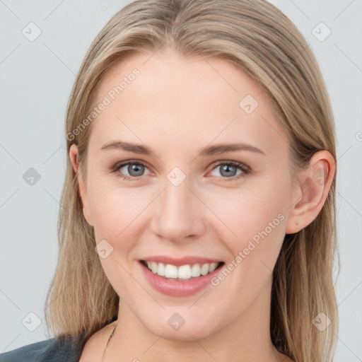 Joyful white young-adult female with long  brown hair and blue eyes