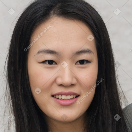 Joyful asian young-adult female with long  brown hair and brown eyes