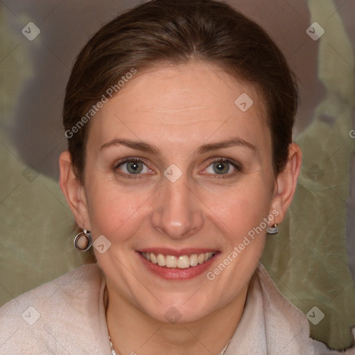 Joyful white adult female with medium  brown hair and grey eyes