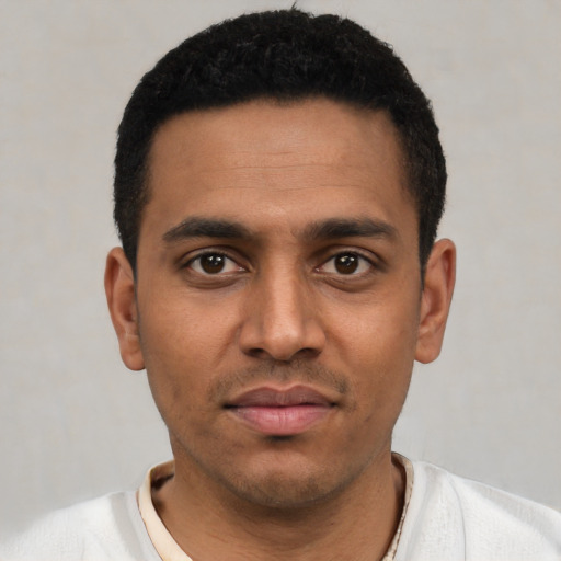 Neutral latino young-adult male with short  black hair and brown eyes