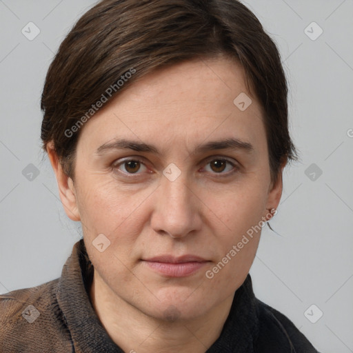 Joyful white adult female with short  brown hair and grey eyes