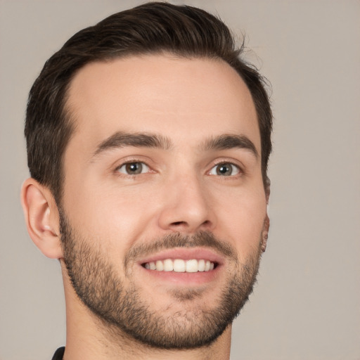 Joyful white young-adult male with short  brown hair and brown eyes