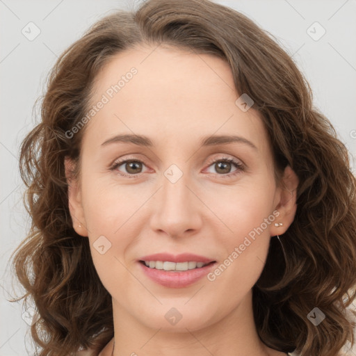 Joyful white young-adult female with long  brown hair and green eyes