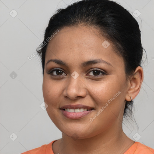 Joyful latino young-adult female with medium  brown hair and brown eyes