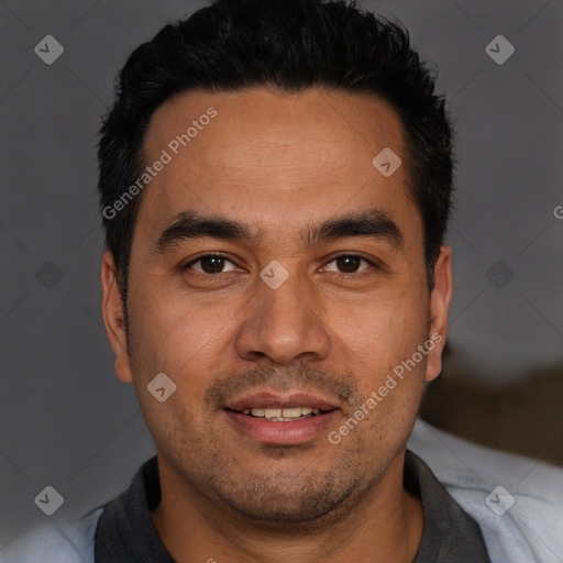 Joyful white young-adult male with short  black hair and brown eyes