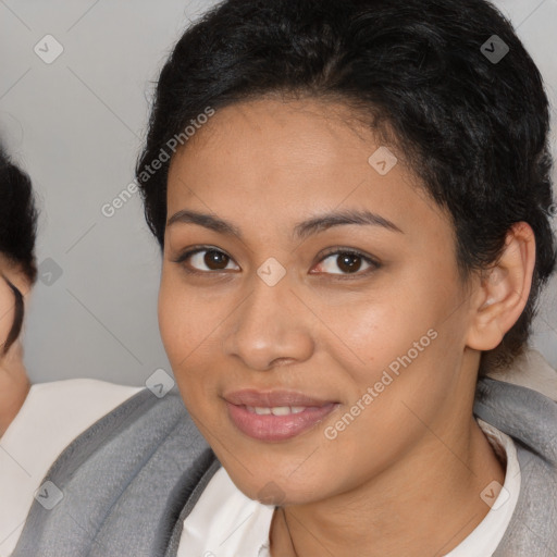 Joyful latino young-adult female with short  brown hair and brown eyes