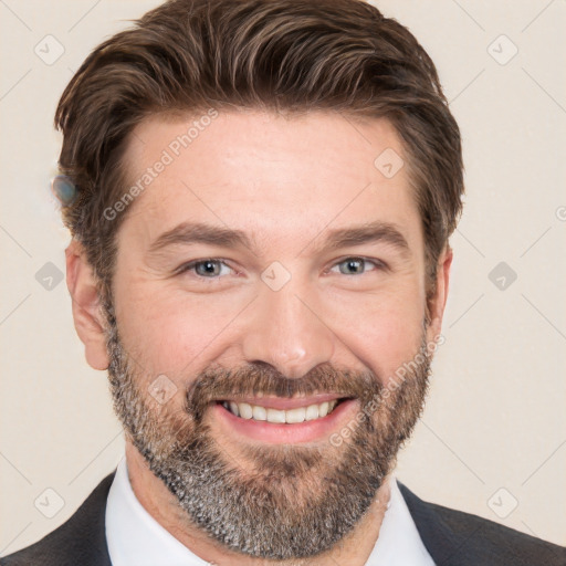 Joyful white adult male with short  brown hair and brown eyes