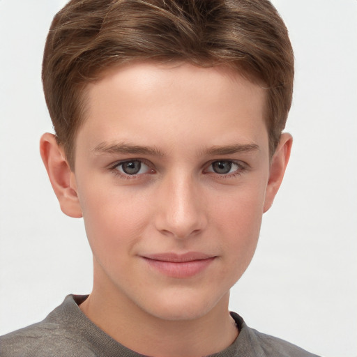 Joyful white child male with short  brown hair and grey eyes