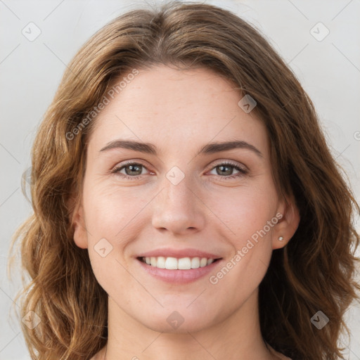 Joyful white young-adult female with long  brown hair and green eyes