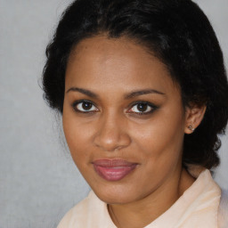 Joyful black young-adult female with medium  brown hair and brown eyes