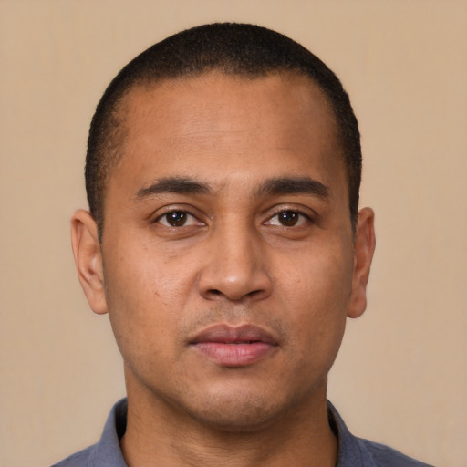 Neutral latino young-adult male with short  brown hair and brown eyes