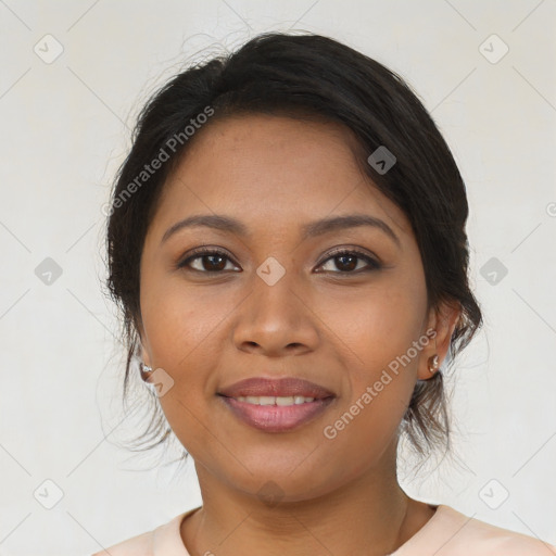 Joyful latino young-adult female with medium  brown hair and brown eyes