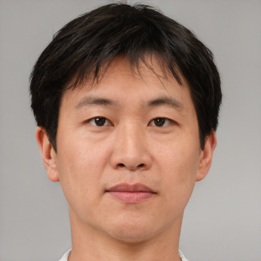 Neutral asian adult male with short  brown hair and brown eyes