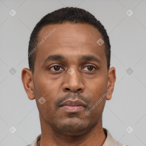 Neutral latino young-adult male with short  brown hair and brown eyes