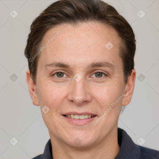 Joyful white adult female with short  brown hair and grey eyes