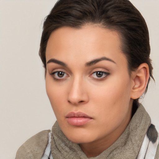 Neutral white young-adult female with medium  brown hair and brown eyes