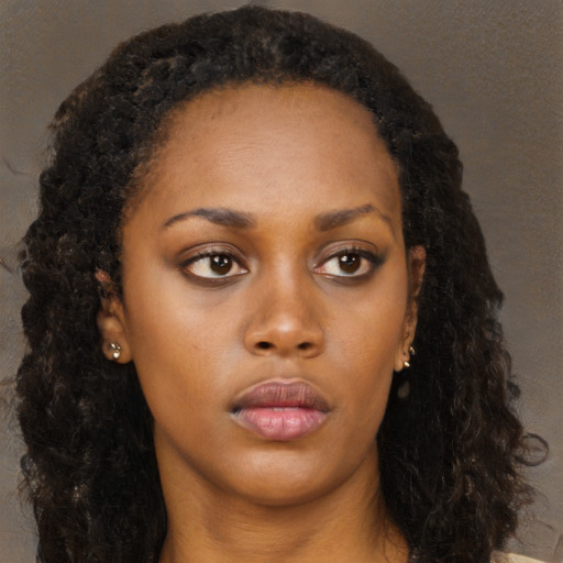 Neutral black young-adult female with long  brown hair and brown eyes