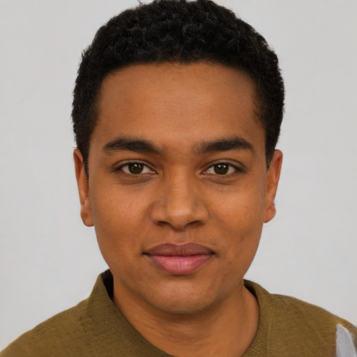 Joyful black young-adult male with short  black hair and brown eyes
