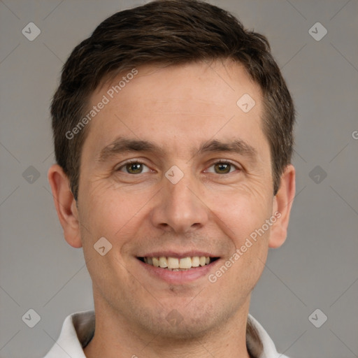 Joyful white adult male with short  brown hair and brown eyes