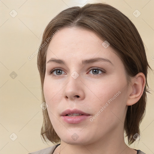 Neutral white young-adult female with medium  brown hair and grey eyes