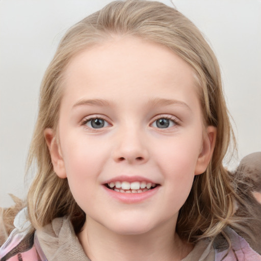 Joyful white child female with medium  brown hair and blue eyes