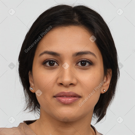 Joyful latino young-adult female with medium  brown hair and brown eyes