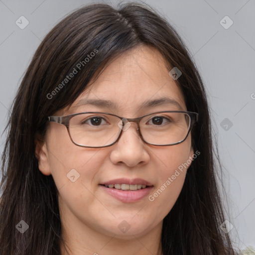 Joyful white adult female with long  brown hair and brown eyes