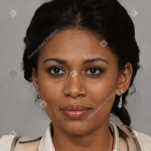 Joyful black adult female with medium  black hair and brown eyes