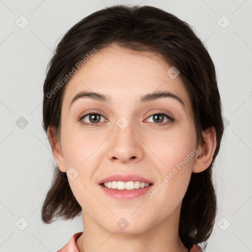 Joyful white young-adult female with medium  brown hair and brown eyes