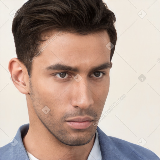 Neutral white young-adult male with short  brown hair and brown eyes